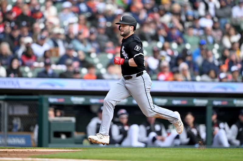 Apr 6, 2025; Detroit, Michigan, USA;  Chicago White Sox designated hitter Andrew Benintendi (23) scores a run on a sacrifice fly against the Detroit Tigers in the first inning at Comerica Park. Mandatory Credit: Lon Horwedel-Imagn Images