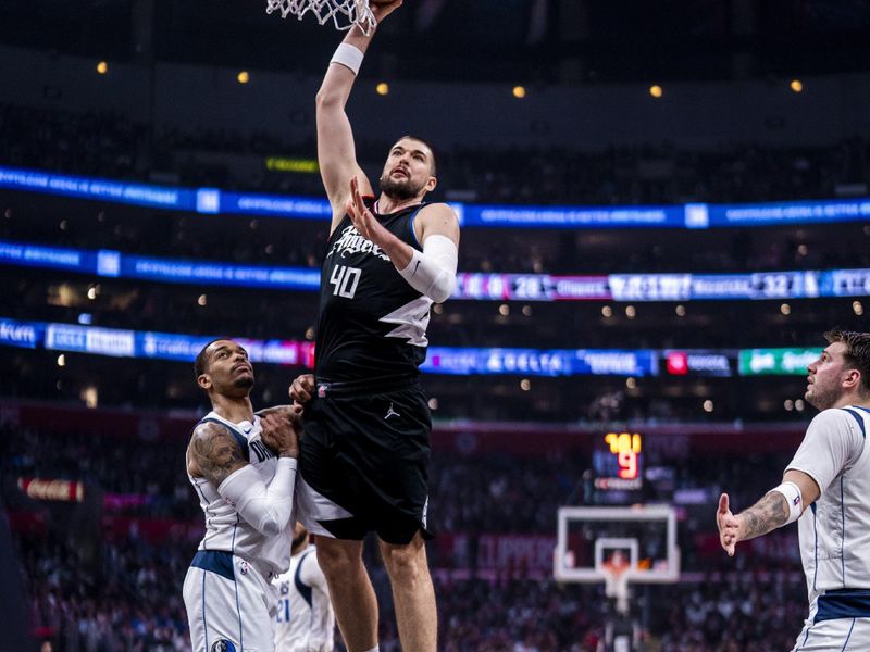 LOS ANGELES, CA - APRIL 23: Ivica Zubac #40 of the LA Clippers drives to the basket during the game against the Dallas Mavericks during Round 1 Game 2 of the 2024 NBA Playoffs on April 23, 2024 at Crypto.Com Arena in Los Angeles, California. NOTE TO USER: User expressly acknowledges and agrees that, by downloading and/or using this Photograph, user is consenting to the terms and conditions of the Getty Images License Agreement. Mandatory Copyright Notice: Copyright 2024 NBAE (Photo by Tyler Ross/NBAE via Getty Images)