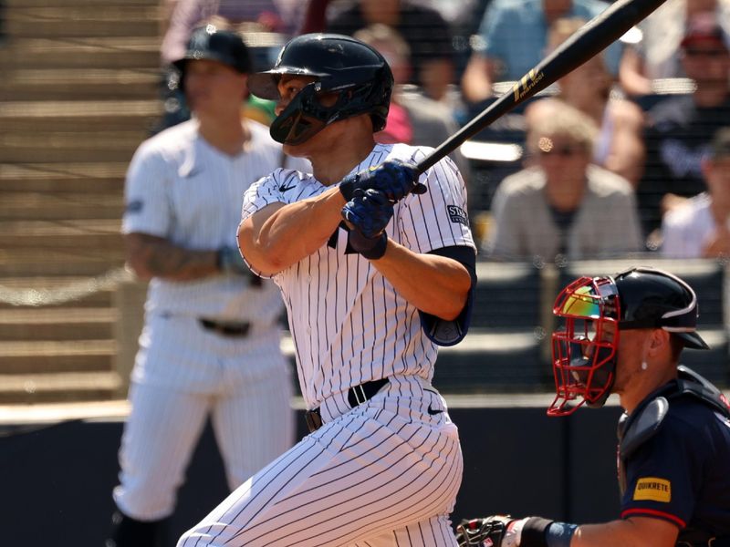 Mar 10, 2024; Tampa, Florida, USA;New York Yankees designated hitter Giancarlo Stanton (27) doubles during the second inning against the Atlanta Braves at George M. Steinbrenner Field. Mandatory Credit: Kim Klement Neitzel-USA TODAY Sports