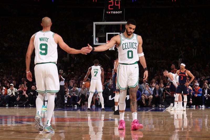 NEW YORK, NY - MAY 12: Derrick White #9 and Jayson Tatum #0 of the Boston Celtics high five during the game against the New York Knicks during Round 2 Game 4 of the 2025 NBA Playoffs on May 12, 2025 at Madison Square Garden in New York City, New York.  NOTE TO USER: User expressly acknowledges and agrees that, by downloading and or using this photograph, User is consenting to the terms and conditions of the Getty Images License Agreement. Mandatory Copyright Notice: Copyright 2025 NBAE  (Photo by Nathaniel S. Butler/NBAE via Getty Images)