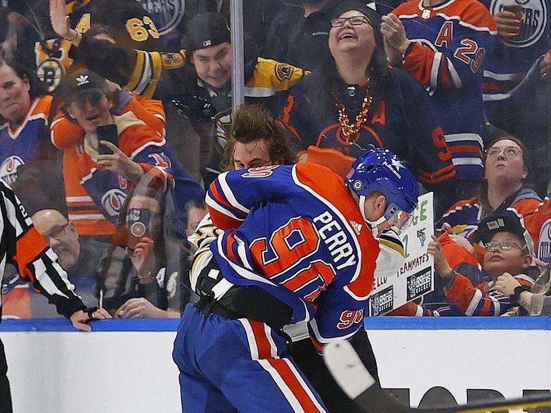 Feb 21, 2024; Edmonton, Alberta, CAN; Edmonton Oilers forward Corey Perry (90) and Boston Bruins defensemen Parker Wotherspoon (29) fight during the second period at Rogers Place. Mandatory Credit: Perry Nelson-USA TODAY Sports