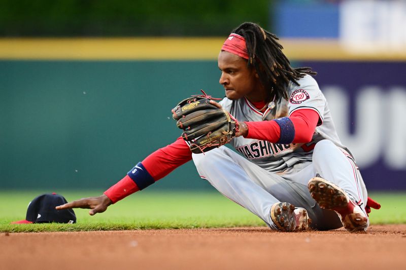 May 31, 2024; Cleveland, Ohio, USA; Washington Nationals shortstop CJ Abrams (5) gets up after misplaying a ball hit by Cleveland Guardians center fielder Tyler Freeman (not pictured) during the third inning at Progressive Field. Mandatory Credit: Ken Blaze-USA TODAY Sports