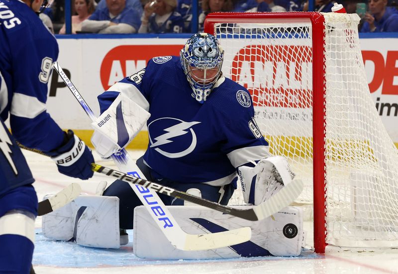 Mar 14, 2024; Tampa, Florida, USA; Tampa Bay Lightning goaltender Andrei Vasilevskiy (88) makes a save against the New York Rangers during the second period at Amalie Arena. Mandatory Credit: Kim Klement Neitzel-USA TODAY Sports