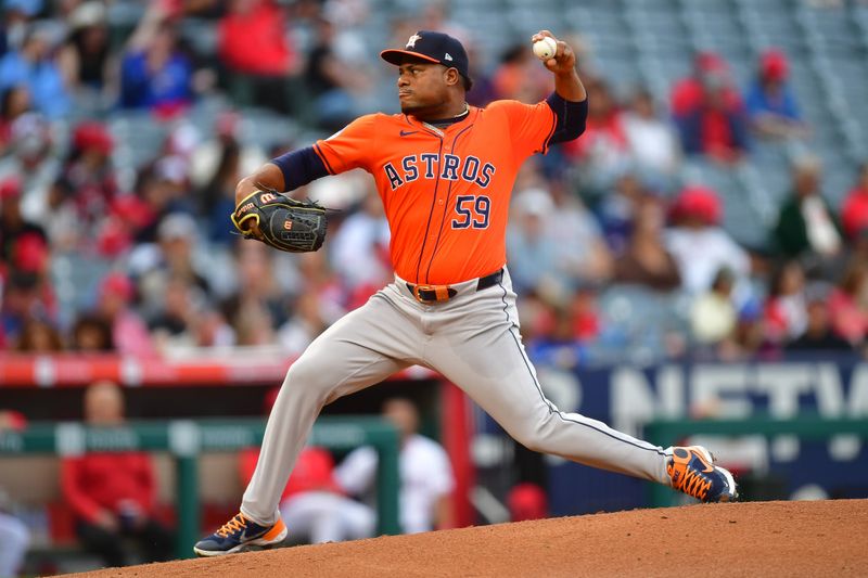 Jun 7, 2024; Anaheim, California, USA; Houston Astros pitcher Framber Valdez (59) throws against the Los Angeles Angels during the first inning at Angel Stadium. Mandatory Credit: Gary A. Vasquez-USA TODAY Sports