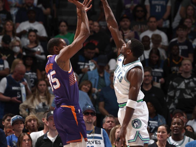 MINNEAPOLIS, MN -  APRIL 14: Kevin Durant #35 of the Phoenix Suns shoots the ball while Anthony Edwards #5 of the Minnesota Timberwolves goes up for the block during the game on April 14, 2024 at Target Center in Minneapolis, Minnesota. NOTE TO USER: User expressly acknowledges and agrees that, by downloading and or using this Photograph, user is consenting to the terms and conditions of the Getty Images License Agreement. Mandatory Copyright Notice: Copyright 2024 NBAE (Photo by David Sherman/NBAE via Getty Images)