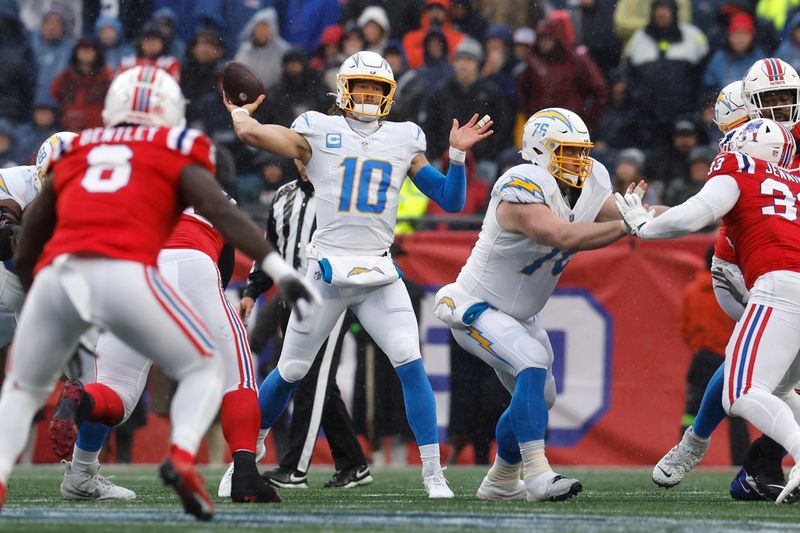 Los Angeles Chargers quarterback Justin Herbert (10) throws during the first half of an NFL football game against the New England Patriots, Sunday, Dec. 3, 2023, in Foxborough, Mass. (AP Photo/Michael Dwyer)