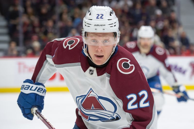 Jan 16, 2024; Ottawa, Ontario, CAN; Colorado Avalanche left wing Fredrik Olofsson (22) chases the puck in the first period against the Ottawa Senators at the Canadian Tire Centre. Mandatory Credit: Marc DesRosiers-USA TODAY Sports