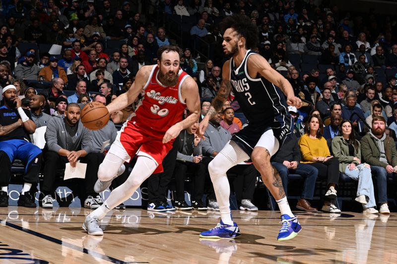 MEMPHIS, TN - JANUARY 6:   Jay Huff #30 of the Memphis Grizzlies dribbles the ball during the game against the Dallas Mavericks on January  6, 2024 at FedExForum in Memphis, Tennessee. NOTE TO USER: User expressly acknowledges and agrees that, by downloading and or using this photograph, User is consenting to the terms and conditions of the Getty Images License Agreement. Mandatory Copyright Notice: Copyright 2024 NBAE (Photo by Grant Burke/NBAE via Getty Images)