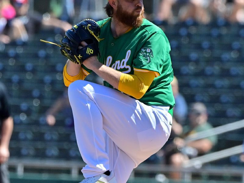 Mar 20, 2024; Mesa, Arizona, USA;  Oakland Athletics starting pitcher Paul Blackburn (58) throws in the first inning against the Chicago Cubs during a spring training game at Hohokam Stadium. Mandatory Credit: Matt Kartozian-USA TODAY Sports