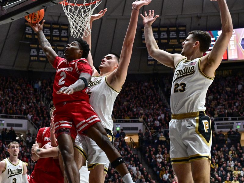 Mar 10, 2024; West Lafayette, Indiana, USA; Wisconsin Badgers guard AJ Storr (2) shoots the ball in front of Purdue Boilermakers center Zach Edey (15) during the first half at Mackey Arena. Mandatory Credit: Marc Lebryk-USA TODAY Sports