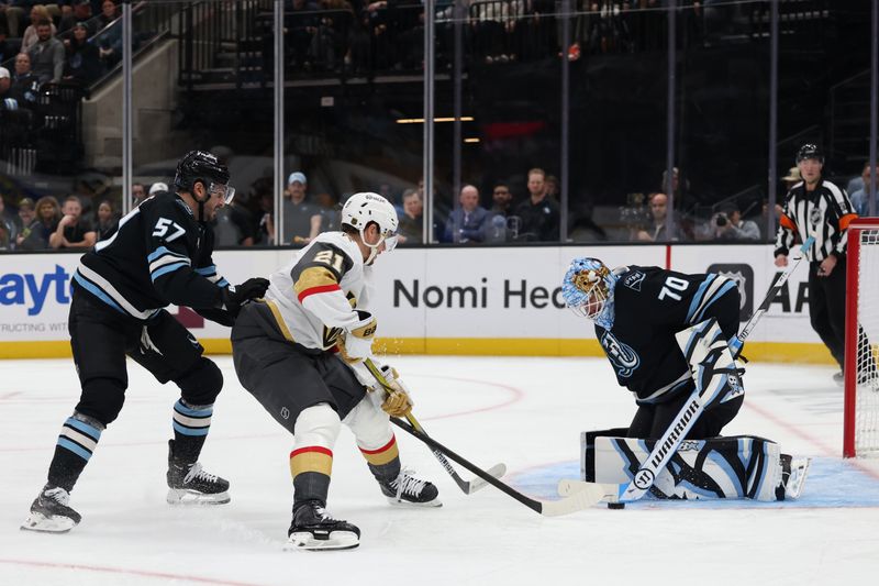 Nov 20, 2025; Salt Lake City, Utah, USA; Vegas Golden Knights center Brett Howden (21) has a shot blocked by Utah Mammoth goaltender Karel Vejmelka (70) during the second period at Delta Center. Mandatory Credit: Rob Gray-Imagn Images