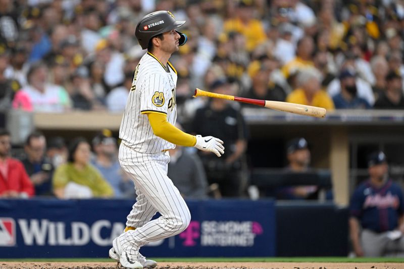 Oct 2, 2024; San Diego, California, USA; San Diego Padres catcher Kyle Higashioka (20) hits a solo home run during the second inning of game two in the Wildcard round for the 2024 MLB Playoffs against the Atlanta Braves at Petco Park. Mandatory Credit: Denis Poroy-Imagn Images