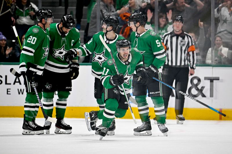 Feb 29, 2024; Dallas, Texas, USA; Dallas Stars center Logan Stankoven (11) and left wing Jamie Benn (14) and defenseman Ryan Suter (20) and center Wyatt Johnston (53) celebrates a goal scored by Stankoven against the Winnipeg Jets during the first period at the American Airlines Center. Mandatory Credit: Jerome Miron-USA TODAY Sports