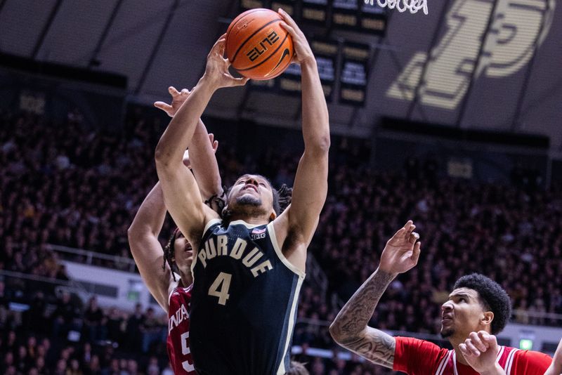 Feb 10, 2024; West Lafayette, Indiana, USA; Purdue Boilermakers forward Trey Kaufman-Renn (4) shoots the ball while Indiana Hoosiers forward Malik Reneau (5) defends in the second half at Mackey Arena. Mandatory Credit: Trevor Ruszkowski-USA TODAY Sports