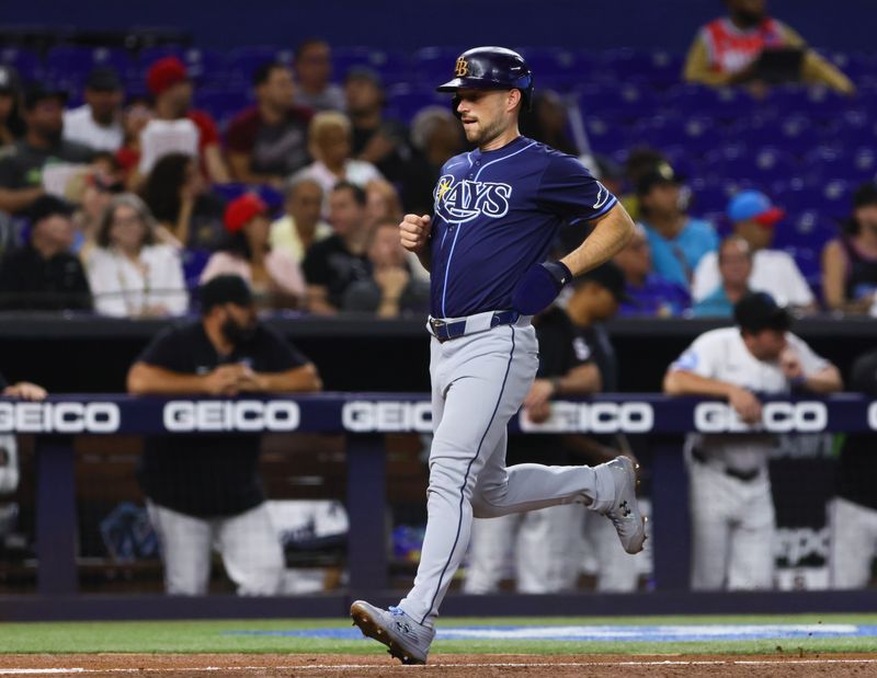 Jun 5, 2024; Miami, Florida, USA; Tampa Bay Rays second baseman Brandon Lowe (8) scores against the Miami Marlins during the first inning at loanDepot Park. Mandatory Credit: Sam Navarro-USA TODAY Sports