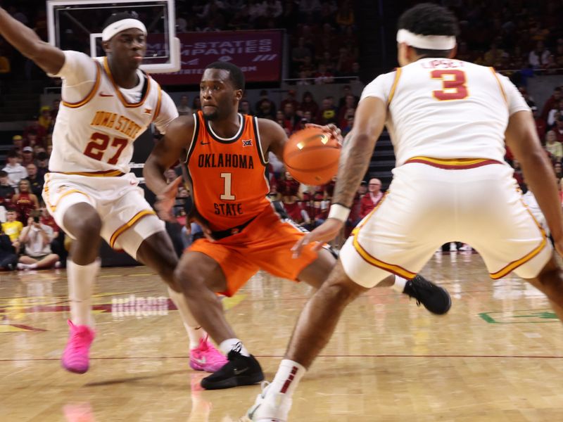 Jan 10, 2026; Ames, Iowa, USA; Iowa State Cyclones guard Jamarion Batemon (1) is defended by Iowa State Cyclones guard Killyan Toure (27) during the second half at James H. Hilton Coliseum. Mandatory Credit: Reese Strickland-Imagn Images