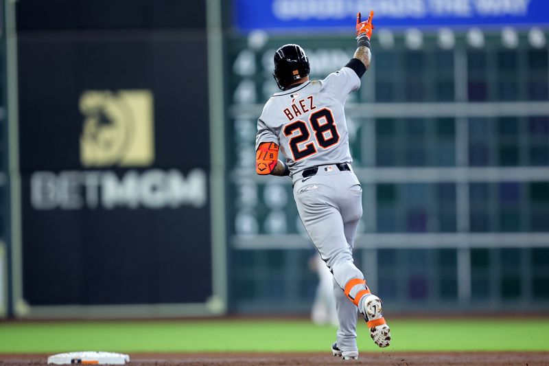 Apr 30, 2025; Houston, Texas, USA; Detroit Tigers center fielder Javier Baez (28) reacts after hitting a grand slam home run against the Houston Astros during the third inning at Daikin Park. Mandatory Credit: Erik Williams-Imagn Images