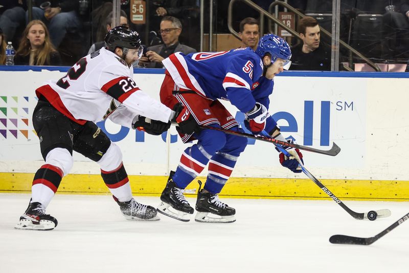 Mar 23, 2026; New York, New York, USA;  Ottawa Senators right wing Michael Amadio (22) and New York Rangers left wing Will Cuylle (50) battle for control of the puck in the first period at Madison Square Garden. Mandatory Credit: Wendell Cruz-Imagn Images