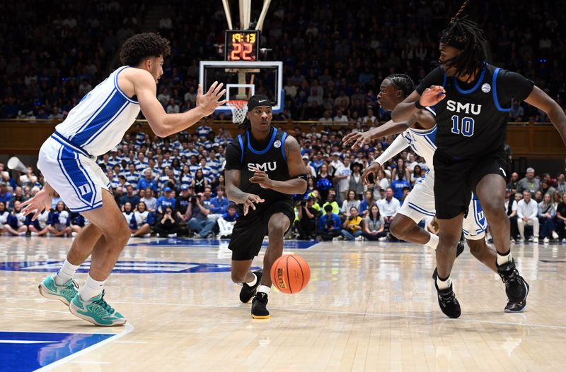 Jan 10, 2026; Durham, North Carolina, USA; Southern Methodist Mustangs guard Jaron Pierre Jr. (5) throws a pass to Southern Methodist Mustangs center Jaden Toombs (10) during the first half at Cameron Indoor Stadium. Mandatory Credit: Rob Kinnan-Imagn Images
