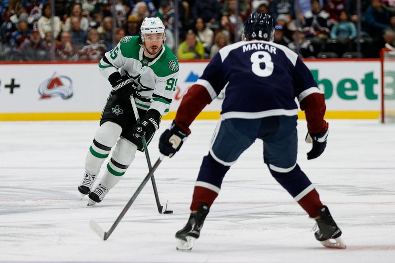 Jan 18, 2025; Denver, Colorado, USA; Dallas Stars center Matt Duchene (95) controls the puck as Colorado Avalanche defenseman Cale Makar (8) defends in the first period at Ball Arena. Mandatory Credit: Isaiah J. Downing-Imagn Images