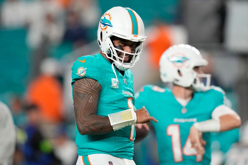 Miami Dolphins quarterback Tua Tagovailoa (1) gestures before an NFL football game against the Tennessee Titans, Monday, Dec. 11, 2023, in Miami, Fla. (AP Photo/Rebecca Blackwell)