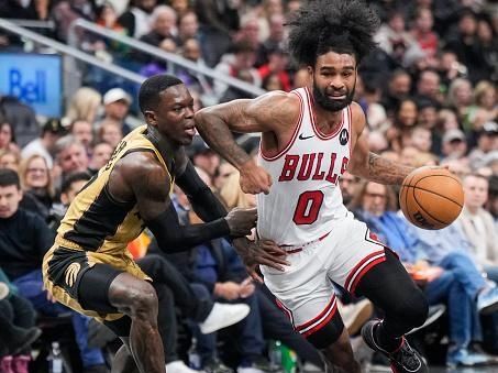 TORONTO, ON - NOVEMBER 24: Coby White #0 of the Chicago Bulls is guarded by Dennis Schroder #17 of Toronto Raptors during the second half of their NBA In-Season Tournament game at the Scotiabank Arena on November 24, 2023 in Toronto, Ontario, Canada. NOTE TO USER: User expressly acknowledges and agrees that, by downloading and/or using this Photograph, user is consenting to the terms and conditions of the Getty Images License Agreement. (Photo by Mark Blinch/Getty Images)