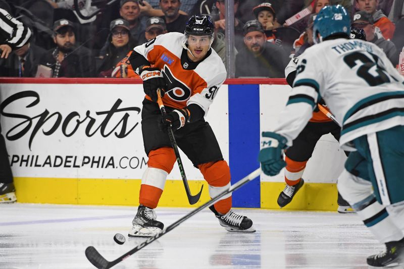 Nov 11, 2024; Philadelphia, Pennsylvania, USA; Philadelphia Flyers center Anthony Richard (90) passes the puck against San Jose Sharks defenseman Jack Thompson (26) during the first period at Wells Fargo Center. Mandatory Credit: Eric Hartline-Imagn Images