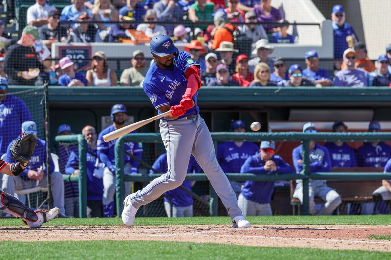 Feb 25, 2026; Lakeland, Florida, USA; Toronto Blue Jays outfielder Eloy Jiménez (74) singles during the fourth inning against the Detroit Tigers at Publix Field at Joker Marchant Stadium. Mandatory Credit: Mike Watters-Imagn Images