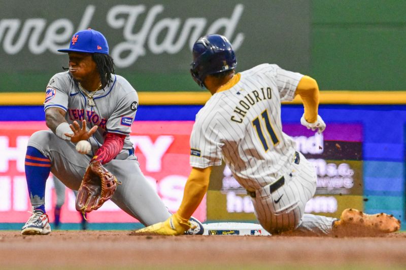 Sep 28, 2024; Milwaukee, Wisconsin, USA; Milwaukee Brewers right fielder Jackson Chourio (11) steals second base as New York Mets shortstop Luisangel Acuna (2) gets the ball in the first inning at American Family Field. Mandatory Credit: Benny Sieu-Imagn Images