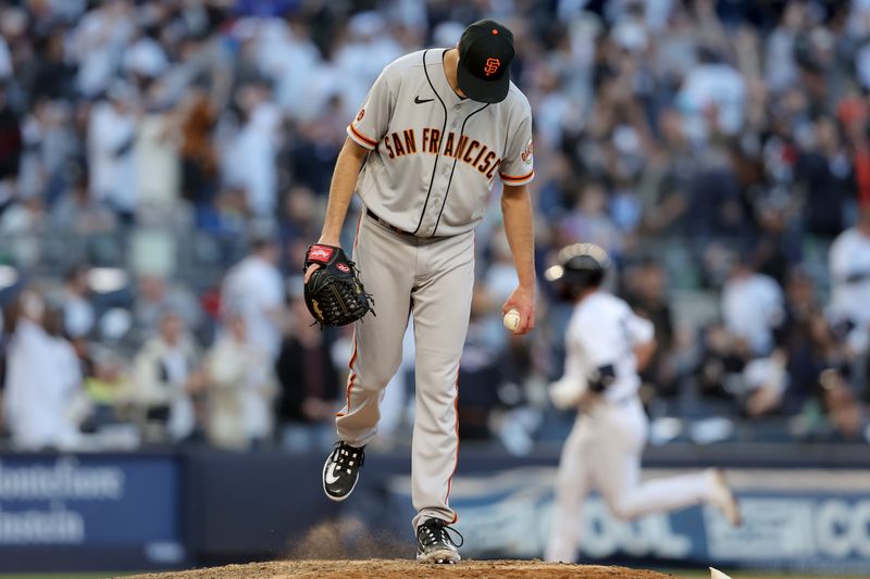 Apr 1, 2023; Bronx, New York, USA; San Francisco Giants relief pitcher Taylor Rogers (33) reacts after allowing a solo home run to New York Yankees third baseman Josh Donaldson (28) during the eighth inning at Yankee Stadium. Mandatory Credit: Brad Penner-USA TODAY Sports