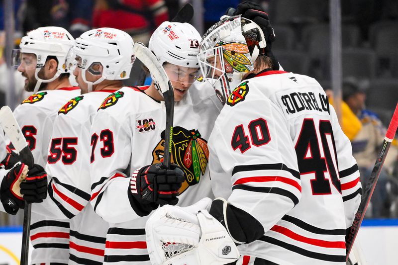 Oct 15, 2025; St. Louis, Missouri, USA; Chicago Blackhawks left wing Lukas Reichel (73) celebrates with goaltender Arvid Soderblom (40) after the Blackhawks defeated the St. Louis Blues at Enterprise Center. Mandatory Credit: Jeff Curry-Imagn Images