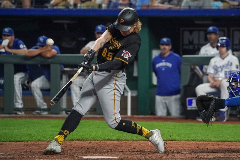 Aug 29, 2023; Kansas City, Missouri, USA; Pittsburgh Pirates center fielder Jack Suwinski (65) connects for a triple against the Kansas City Royals in the ninth inning at Kauffman Stadium. Mandatory Credit: Denny Medley-USA TODAY Sports