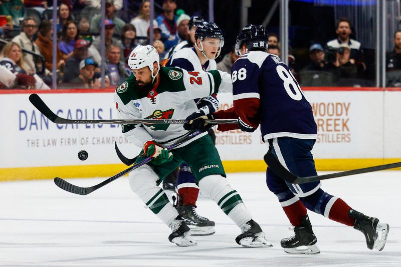 Feb 26, 2026; Denver, Colorado, USA; Minnesota Wild defenseman Zach Bogosian (24) battles for the puck with Colorado Avalanche center Martin Necas (88) in the first period at Ball Arena. Mandatory Credit: Isaiah J. Downing-Imagn Images