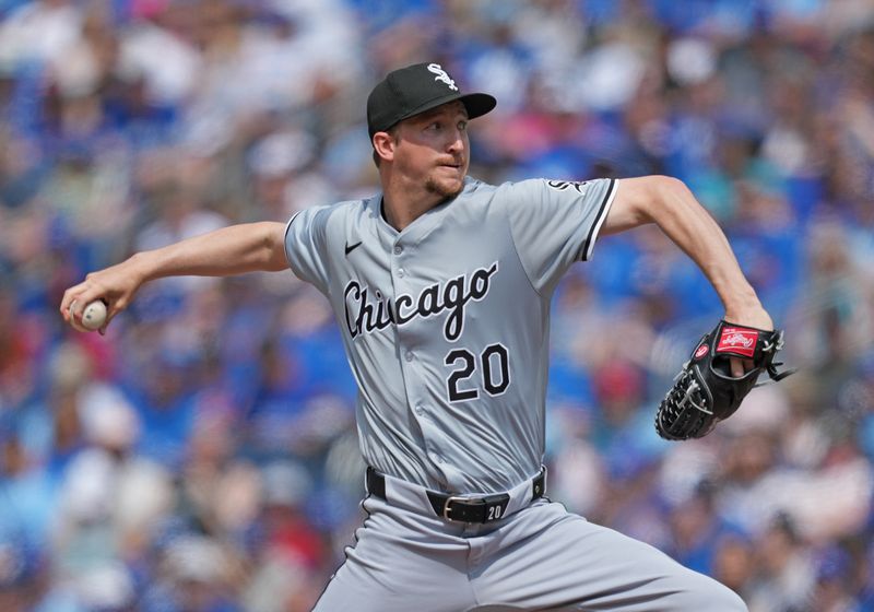 May 20, 2024; Toronto, Ontario, CAN; Chicago White Sox starting pitcher Erick Fedde (20) throws a pitch against the Toronto Blue Jays during the first inning at Rogers Centre. Mandatory Credit: Nick Turchiaro-USA TODAY Sports