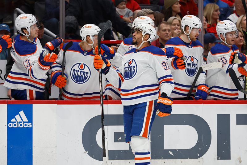 Nov 24, 2023; Washington, District of Columbia, USA; Edmonton Oilers left wing Evander Kane (91) celebrates with teammates after scoring a goal against the Washington Capitals in the first period at Capital One Arena. Mandatory Credit: Geoff Burke-USA TODAY Sports