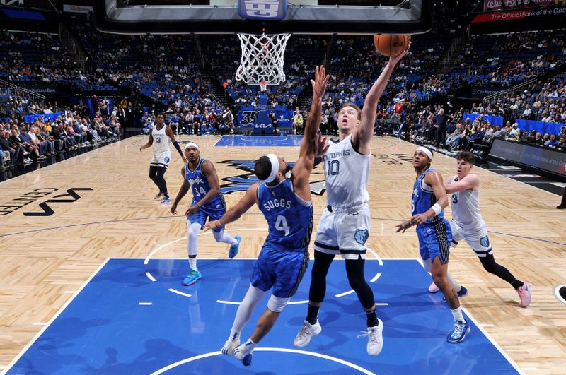 ORLANDO, FL - MARCH 30: Luke Kennard #10 of the Memphis Grizzlies drives to the basket during the game against the Orlando Magic on March 30, 2024 at the Kia Center in Orlando, Florida. NOTE TO USER: User expressly acknowledges and agrees that, by downloading and or using this photograph, User is consenting to the terms and conditions of the Getty Images License Agreement. Mandatory Copyright Notice: Copyright 2024 NBAE (Photo by Fernando Medina/NBAE via Getty Images)