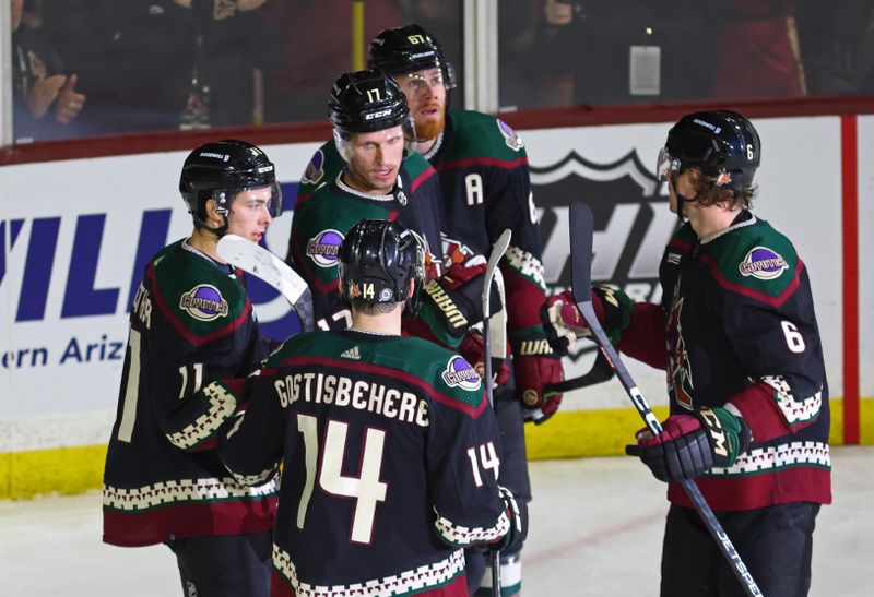 Jan 17, 2023; Tempe, Arizona, USA; Arizona Coyotes center Nick Bjugstad (17) celebrates a goal with teammates against the Detroit Red Wings in the second period at Mullett Arena. Mandatory Credit: Mark J. Rebilas-USA TODAY Sports