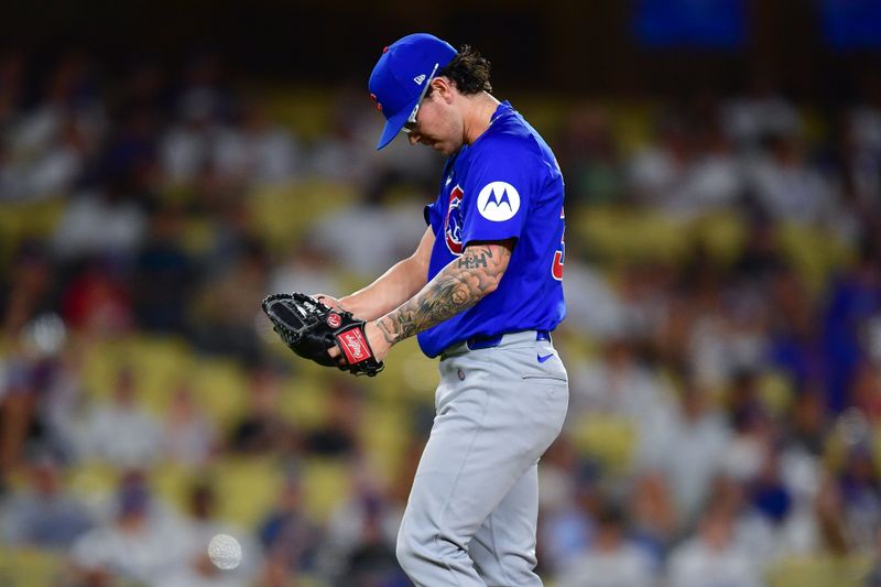 Sep 9, 2024; Los Angeles, California, USA; Chicago Cubs pitcher Ethan Roberts (39) celebrates the victory against the Los Angeles Dodgers at Dodger Stadium. Mandatory Credit: Gary A. Vasquez-Imagn Images