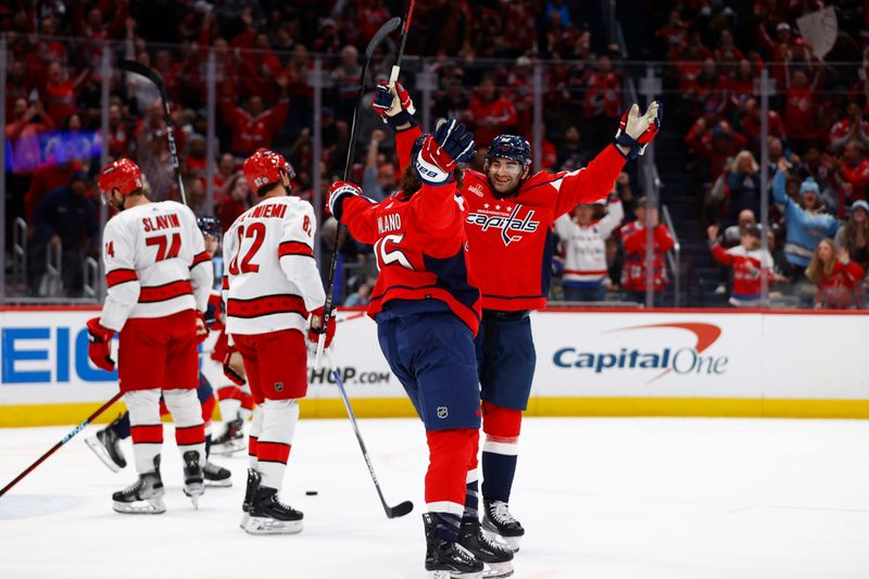 Mar 22, 2024; Washington, District of Columbia, USA; Washington Capitals left wing Sonny Milano (15) celebrates after scoring a goal past Carolina Hurricanes goaltender Pyotr Kochetkov (52) during the first period at Capital One Arena. Mandatory Credit: Amber Searls-USA TODAY Sports