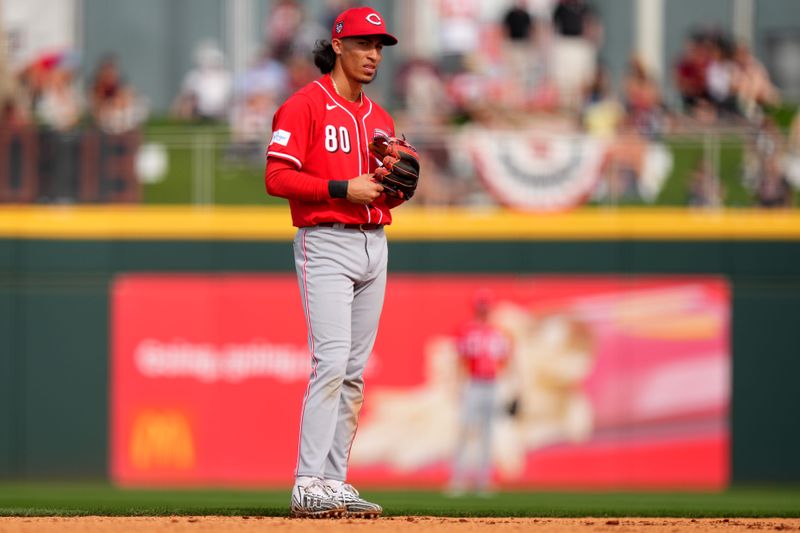 Feb. 24, 2024; Goodyear, Arizona, USA; Cincinnati Reds shortstop Edwin Arroyo looks toward the dugout in between pitches in the seventh inning during a MLB spring training baseball game against the Cleveland Guardians at Goodyear Ballpark. Mandatory Credit: Kareem Elgazzar-USA TODAY Sports