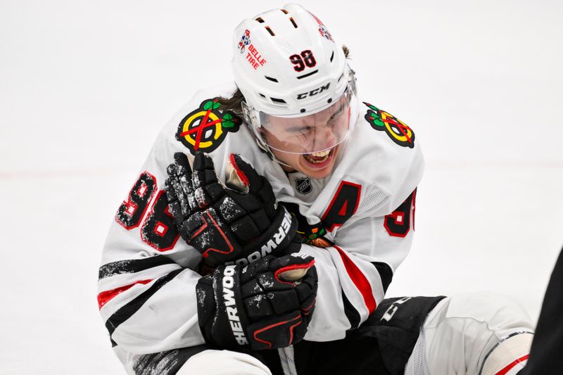 Dec 12, 2025; St. Louis, Missouri, USA; Chicago Blackhawks center Connor Bedard (98) reacts in pain after a face off against St. Louis Blues center Brayden Schenn (not pictured) during the third period at Enterprise Center. Mandatory Credit: Jeff Curry-Imagn Images