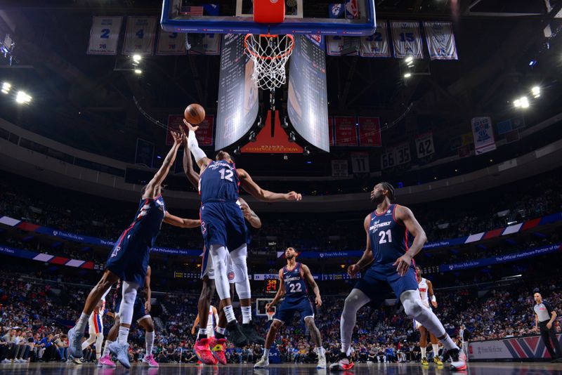 PHILADELPHIA, PA - APRIL 9: Tobias Harris #12 of the Philadelphia 76ers rebounds the ball during the game against the Detroit Pistons on April 9, 2024 at the Wells Fargo Center in Philadelphia, Pennsylvania NOTE TO USER: User expressly acknowledges and agrees that, by downloading and/or using this Photograph, user is consenting to the terms and conditions of the Getty Images License Agreement. Mandatory Copyright Notice: Copyright 2024 NBAE (Photo by Jesse D. Garrabrant/NBAE via Getty Images)