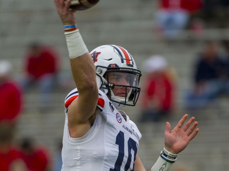 Oct 24, 2020; Oxford, Mississippi, USA; Auburn Tigers quarterback Bo Nix (10) warms up before the game against the Mississippi Rebels  at Vaught-Hemingway Stadium. Mandatory Credit: Justin Ford-USA TODAY Sports