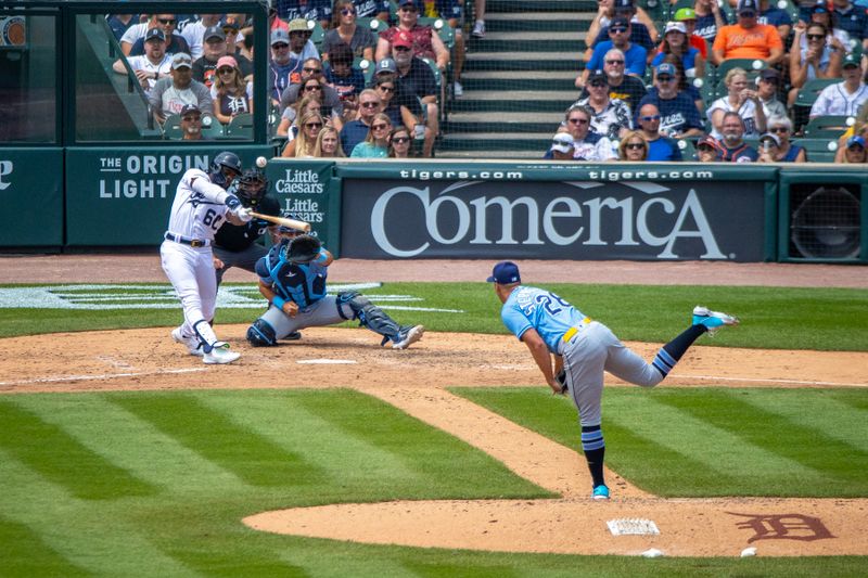 Aug 5, 2023; Detroit, Michigan, USA; Detroit Tigers left fielder Akil Baddoo (60) hits a solo home run in the sixth inning off of Tampa Bay Rays relief pitcher Robert Stephenson (26) at Comerica Park. Mandatory Credit: David Reginek-USA TODAY Sports