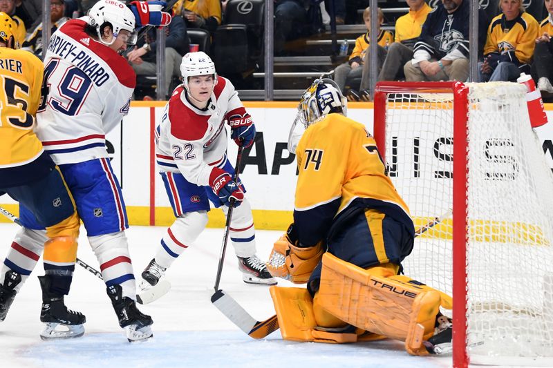 Mar 5, 2024; Nashville, Tennessee, USA; Montreal Canadiens right wing Cole Caufield (22) has a shot blocked by Nashville Predators goaltender Juuse Saros (74) during the second period at Bridgestone Arena. Mandatory Credit: Christopher Hanewinckel-USA TODAY Sports