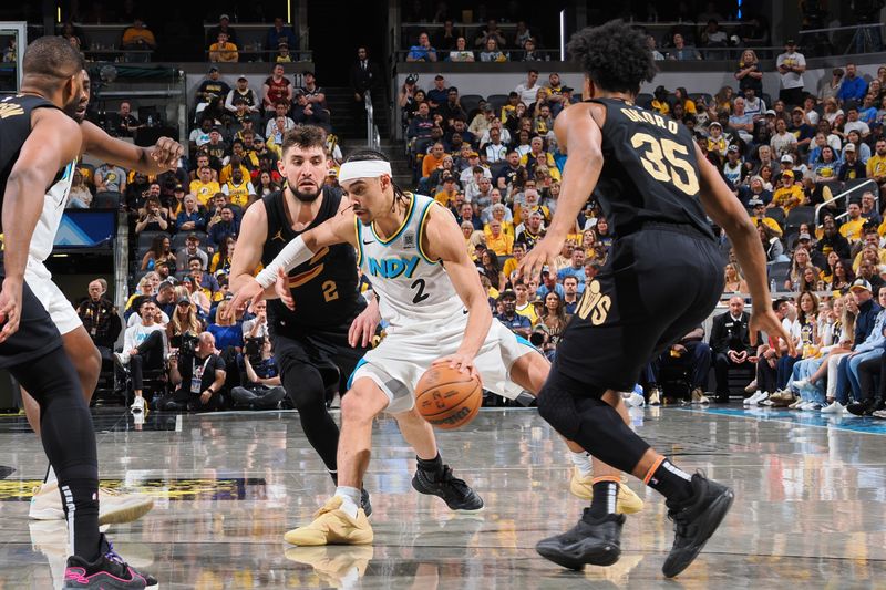 INDIANAPOLIS, IN - MAY 11: Andrew Nembhard #2 of the Indiana Pacers handles the ball during the game against the Cleveland Cavaliers during Round Two Game Four of the 2025 NBA Playoffs on May 11, 2025 at Gainbridge Fieldhouse in Indianapolis, Indiana. NOTE TO USER: User expressly acknowledges and agrees that, by downloading and or using this Photograph, user is consenting to the terms and conditions of the Getty Images License Agreement. Mandatory Copyright Notice: Copyright 2025 NBAE (Photo by Ron Hoskins/NBAE via Getty Images)
