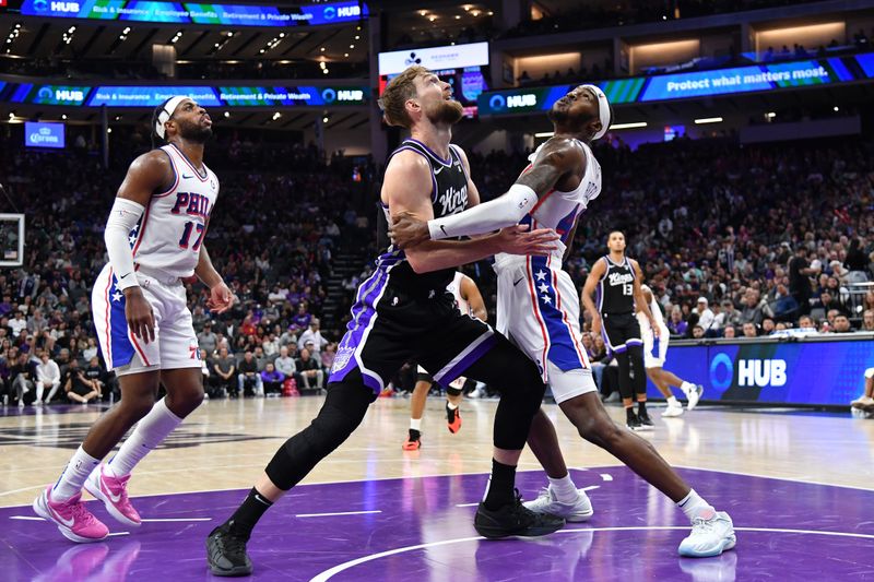 SACRAMENTO, CA - March 25:  Domantas Sabonis #10 of the Sacramento Kings and Paul Reed #44 of the Philadelphia 76ers battle for position on March 25, 2024 at Golden 1 Center in Sacramento, California. NOTE TO USER: User expressly acknowledges and agrees that, by downloading and or using this Photograph, user is consenting to the terms and conditions of the Getty Images License Agreement. Mandatory Copyright Notice: Copyright 2024 NBAE (Photo by Juan Ocampo/NBAE via Getty Images)