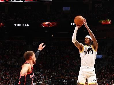 TORONTO, CANADA - DECEMBER 23:  Jordan Clarkson #00 of the Utah Jazz shoots a three point basket during the game against the Toronto Raptors on December 23, 2023 at the Scotiabank Arena in Toronto, Ontario, Canada.  NOTE TO USER: User expressly acknowledges and agrees that, by downloading and or using this Photograph, user is consenting to the terms and conditions of the Getty Images License Agreement.  Mandatory Copyright Notice: Copyright 2023 NBAE (Photo by Vaughn Ridley/NBAE via Getty Images)