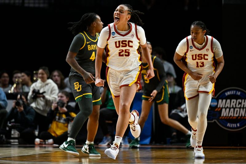 Mar 30, 2024; Portland, OR, USA; USC Trojans guard McKenzie Forbes (25) celebrates after scoring a basket during the first half against the Baylor Lady Bears in the semifinals of the Portland Regional of the 2024 NCAA Tournament at the Moda Center. Mandatory Credit: Troy Wayrynen-USA TODAY Sports