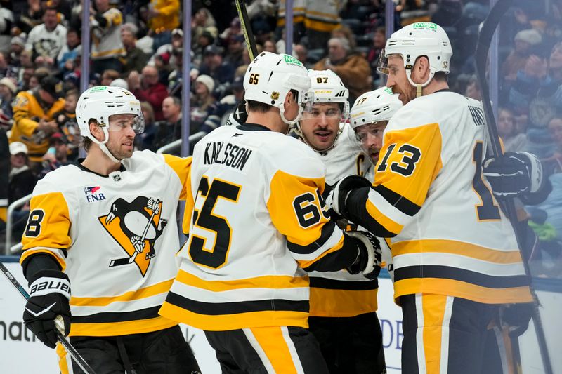 Nov 28, 2025; Columbus, Ohio, USA;  Pittsburgh Penguins right wing Bryan Rust (17) celebrates with teammates after scoring a goal against the Columbus Blue Jackets in the third period at Nationwide Arena. Mandatory Credit: Aaron Doster-Imagn Images